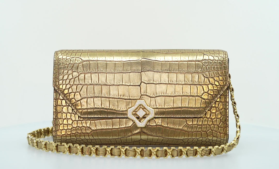 Steel Everywhere Clutch Sculpture | Handbag | Limited Edition | 100% Handmade & Saddle-Stitched in Switzerland | Antique Gold Porosus Crocodile | Diamond Pave Lock